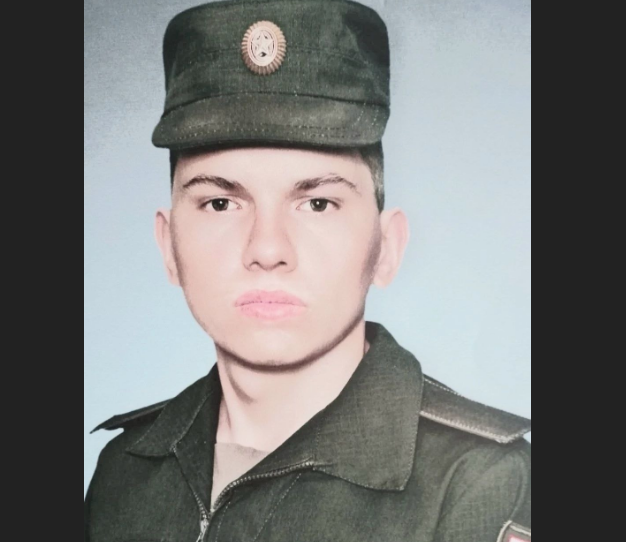 Портрет мужчины в военной форме и фуражке.
